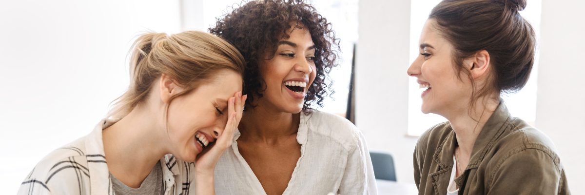 Three 30 year-olds sharing a laugh