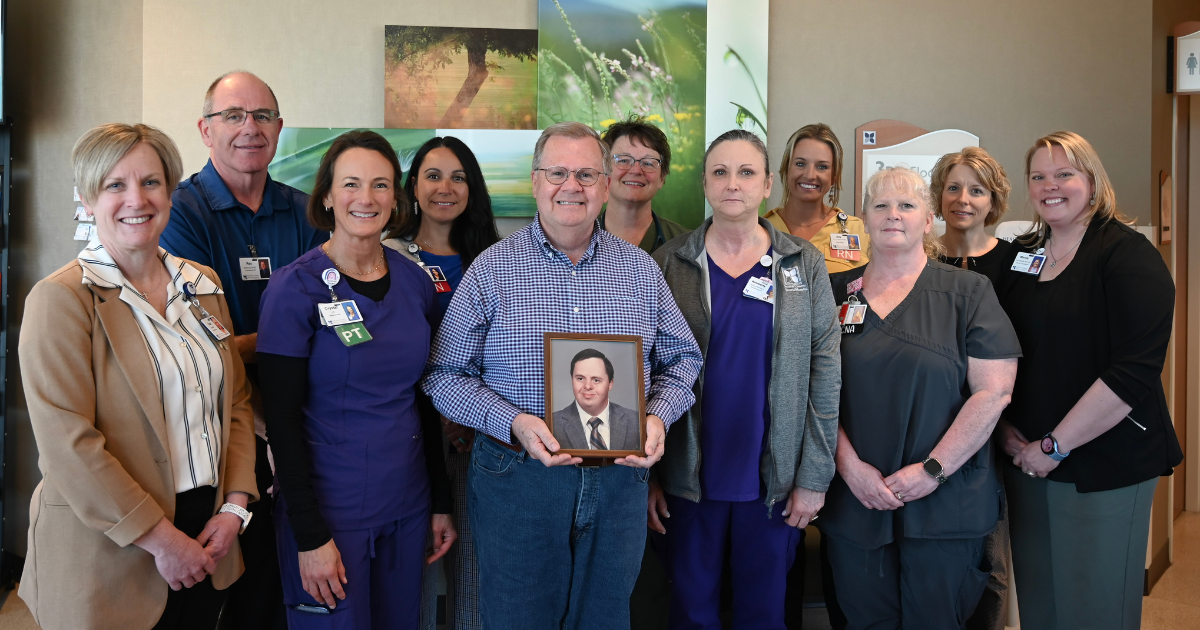 DCMH Team and Brian Jones, Holding a Photo of Trent Jones - Honoring and Remembering A Life Well Lived
