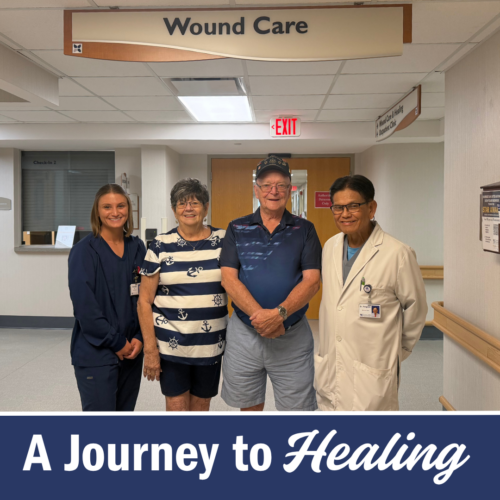Two women a man and a man in a white coat stand under a sign that reads wound care